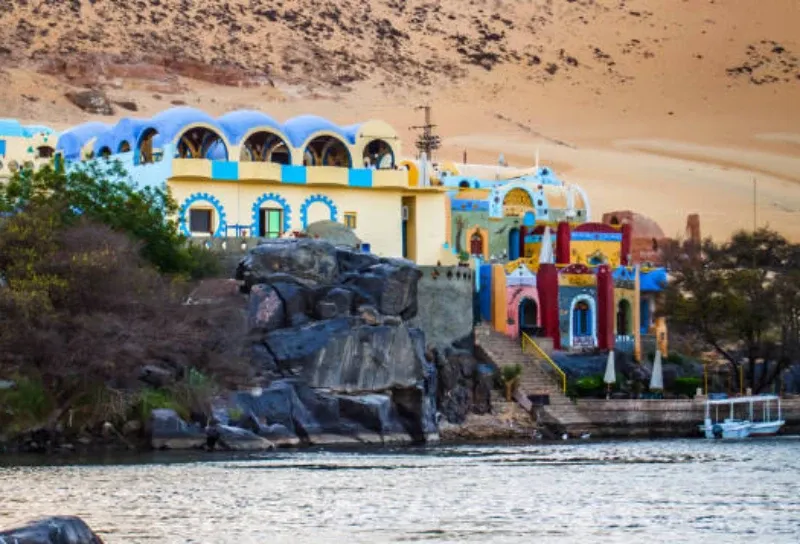 Bissaw Nubian village painted houses Egypt 2026 — brightly coloured geometric facades on mud-brick homes on the Dahabiya route