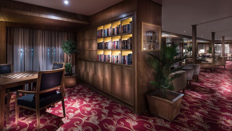 Steigenberger Regency library and fireplace lounge — classic English-style chimney bar, Panorama Bar, JAZ Hotel Group Egypt 2026