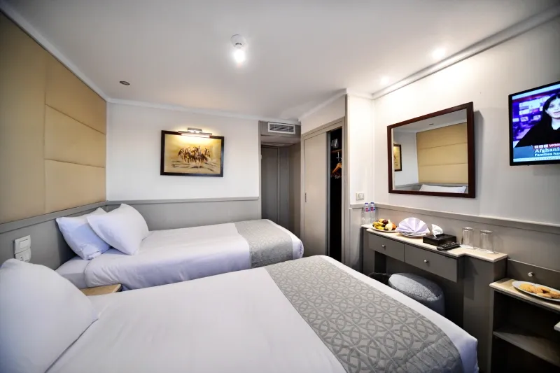 MS Nile Treasure standard twin cabin — 35m² with panoramic Nile-view windows, bathtub, LCD TV and air conditioning