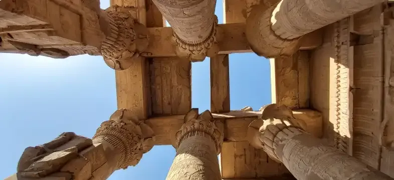 Kom Ombo Temple interior columns Egypt 2026 — double sanctuary reliefs showing Sobek crocodile god left and Haroeris Horus right