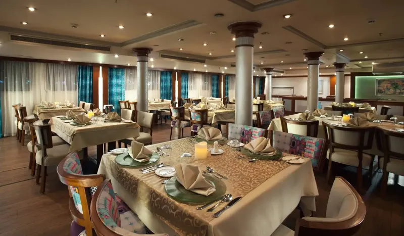 MS Acamar main restaurant with à la carte dining, or the billiard bar and lounge with dance floor and nightly cultural entertainment, Nile cruise Egypt 2026
