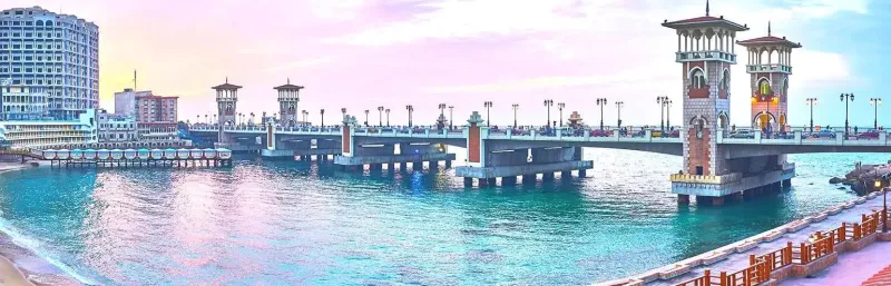 Alexandria Egypt Corniche Mediterranean promenade 2026 — 26km seaside promenade at dusk with Eastern Harbour and city lights