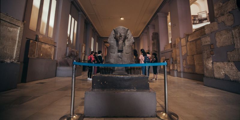 Egyptian Museum Tahrir Cairo — diorite statue of Khafre with Horus falcon wings protecting the pharaoh c.2530 BC finest Old Kingdom sculpture