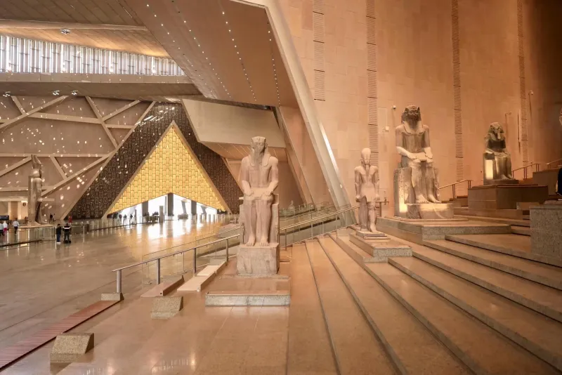 Grand Egyptian Museum GEM grand staircase with Ramesses II colossal statue 11 metres Egypt 2026