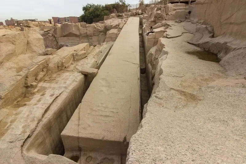 Unfinished Obelisk Aswan Egypt 2026 — 41.75 metres still attached to granite bedrock with cutting channels visible and fatal crack in upper section