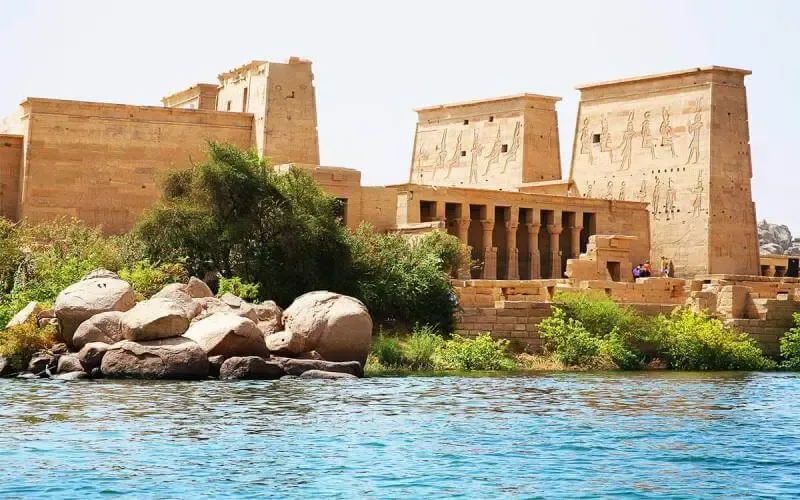 Philae Temple on Agilkia Island Aswan Egypt 2026 — viewed from motorboat approach with Kiosk of Trajan and First Pylon