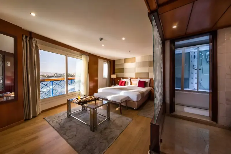 MS Esmeralda Presidential Suite with private Jacuzzi, king-size bed and decorative glass walls