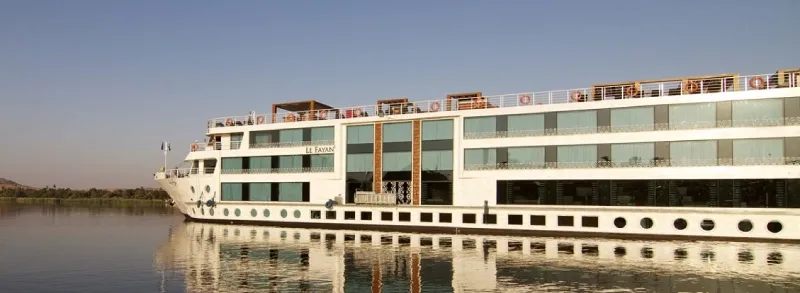 Nile Cruise ship sailing south from Luxor to Aswan — 4 nights on board included in the 8-day Cairo Nile Cruise Luxor Start package Egypt 2026
