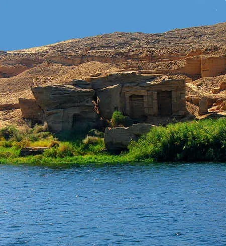 Speos of Horemheb Gebel el Silsila Egypt — rock-cut cave temple with seven seated deities carved into cliff face 18th Dynasty