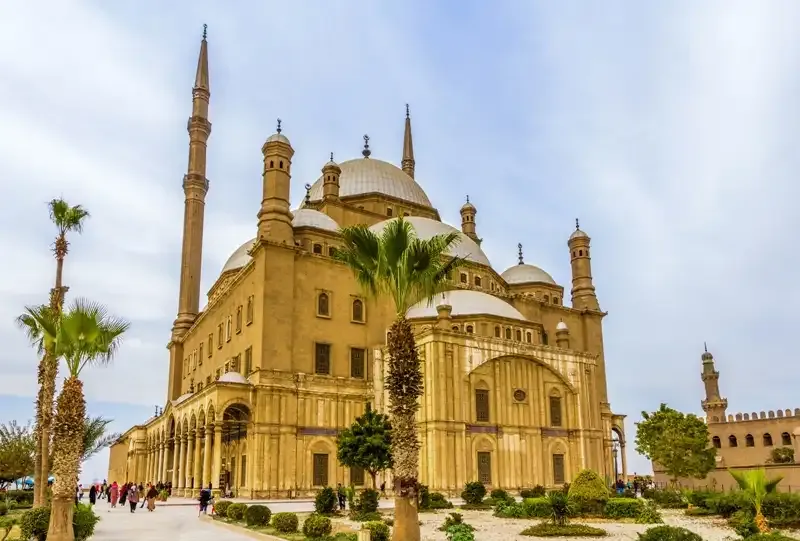  Citadel of Saladin panoramic view Cairo Egypt 2026 — Islamic Cairo minarets below and Pyramids of Giza visible on western horizon