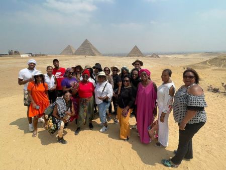First time in Egypt 2026 — aerial view of the Pyramids of Giza with tourists, the iconic starting point of every Egypt itinerary
