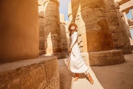 Luxor in one day from a Nile cruise — Karnak Temple Great Hypostyle Hall with massive ancient columns at golden hour, Luxor Egypt 2026