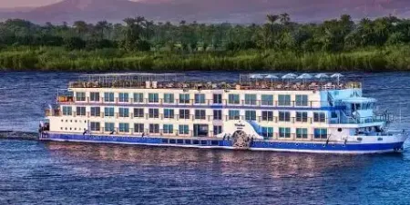 How long should a Nile cruise be — standard cruise ship sailing the Nile between Luxor and Aswan Egypt 2026 with desert landscape