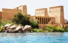 Philae Temple on Agilkia Island Aswan Egypt 2026 — viewed from motorboat approach with Kiosk of Trajan and First Pylon